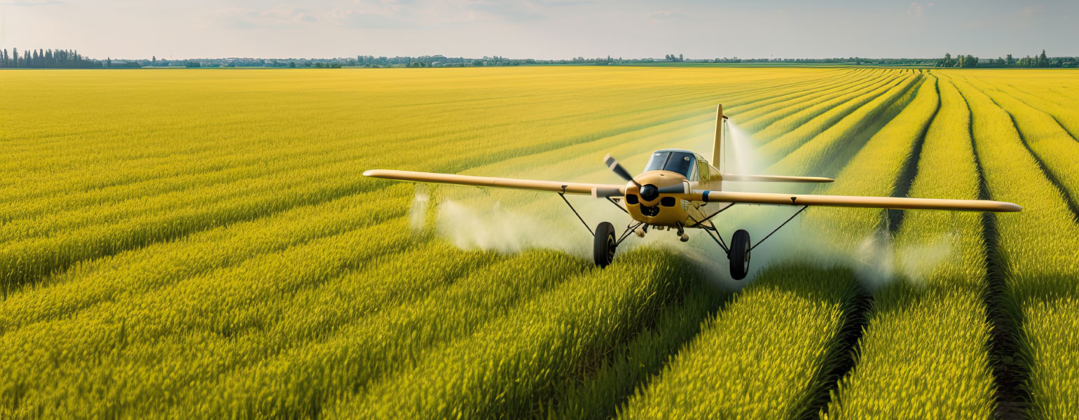 Yellow agricultural aircraft plane watering a field